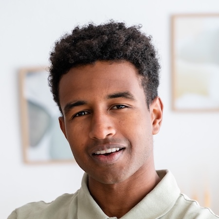 IMG-A4333GD.jpg Confident man portrait, smiling and looking directly at the camera.